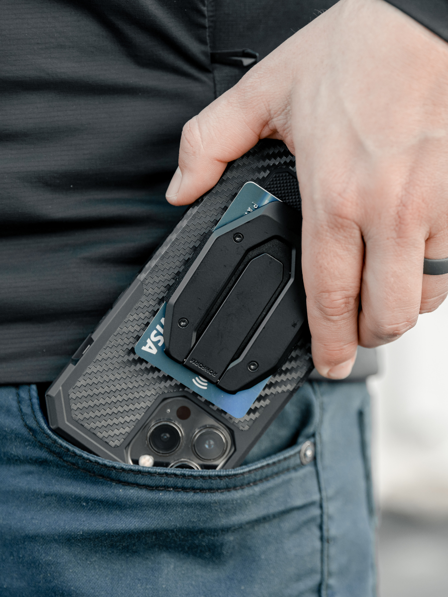 Man holding ROKFORM phone case and aluminum magnetic wallet