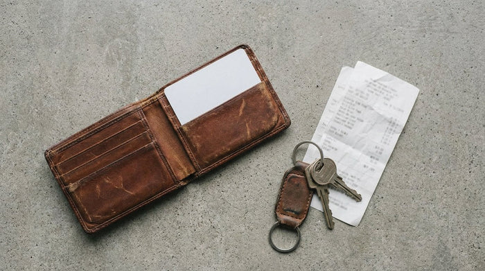Leather wallet with a blank card and keys