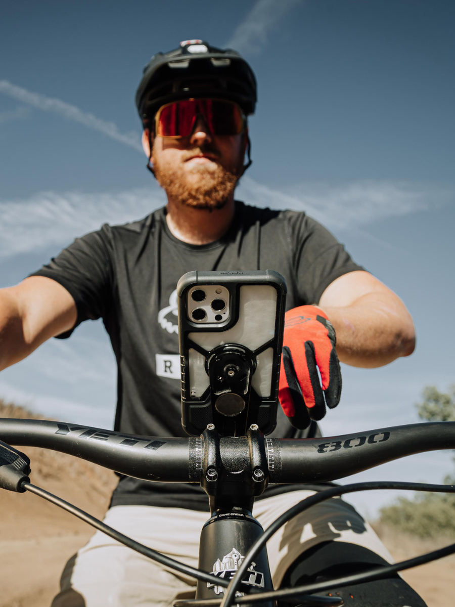 Mountain Biker with ROKFORM V4 Pro Series Phone Mount and ROKFORM iPhone Crystal Case