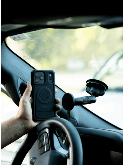 Man using GPS with Rokform phone holder for trucks