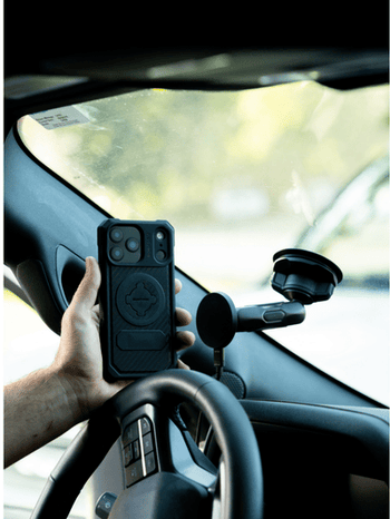 Man using GPS with Rokform phone holder for trucks