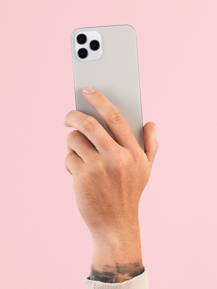 Person holding iPhone wondering when should you upgrade your phone based on performance and battery life