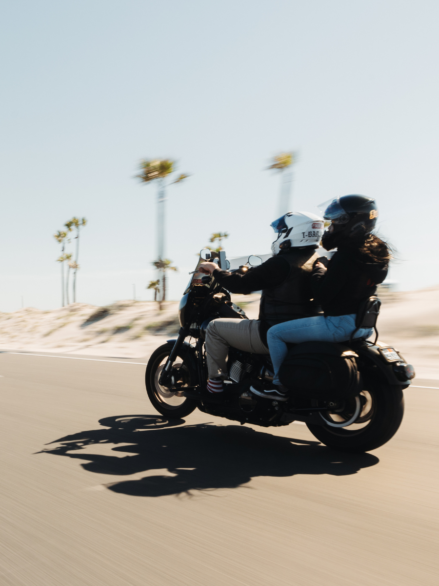 Man and woman riding a motorcycle