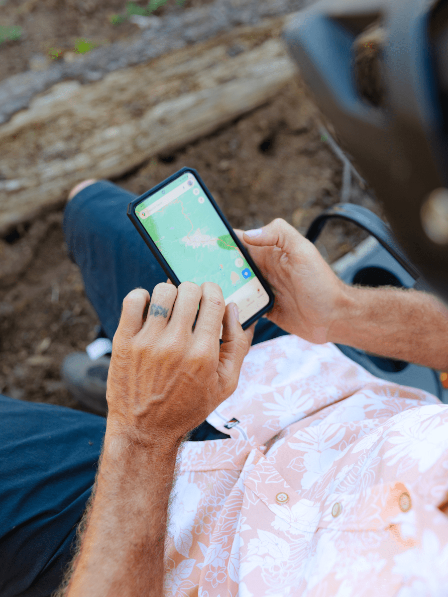 Man holding phone looking at GPS