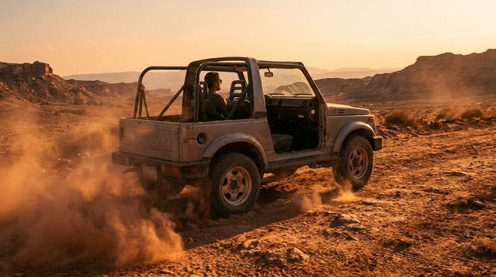 Open-top off-road SUV on a dusty desert trail