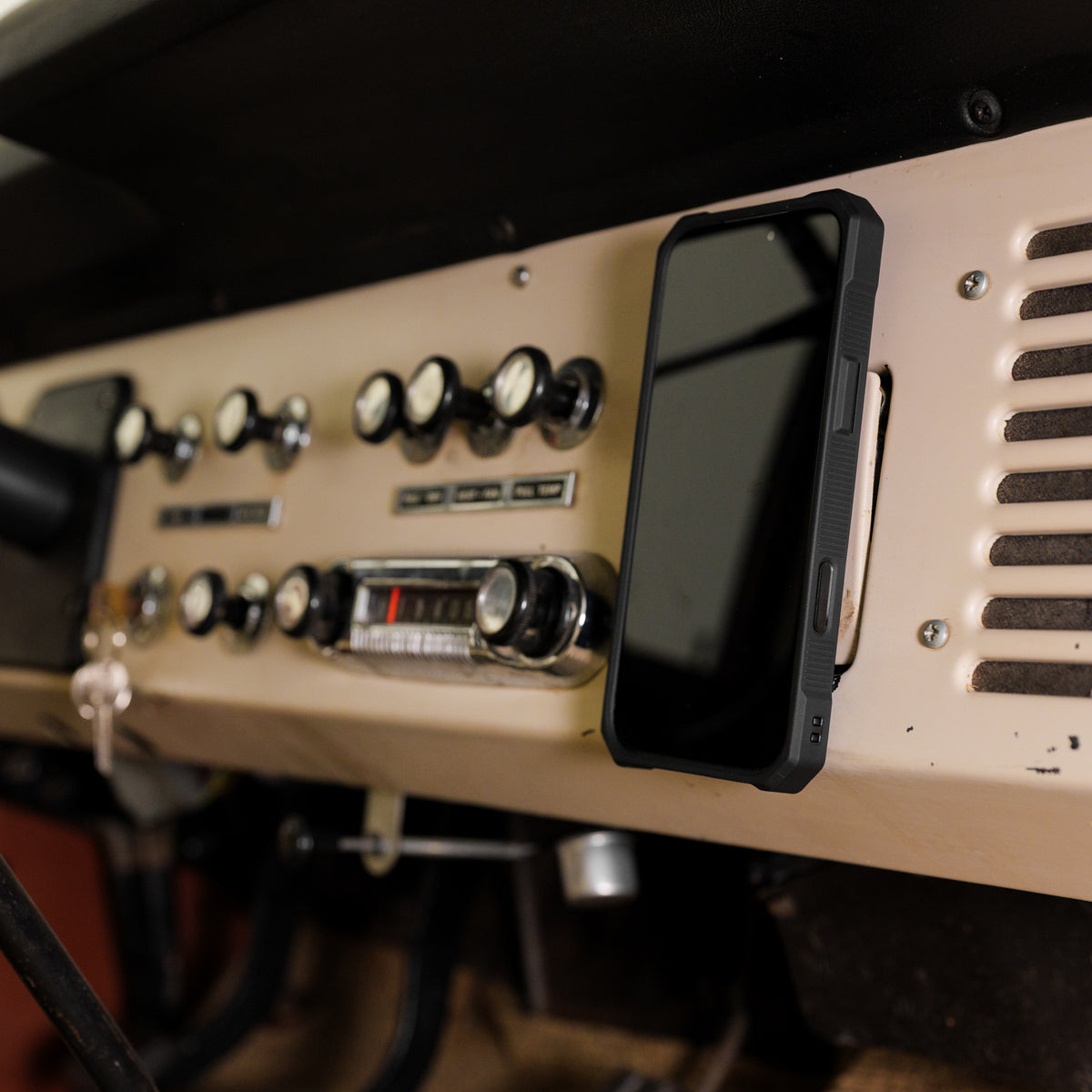 Rokform Rugged Case held on a magnetic car mount inside a Bronco
