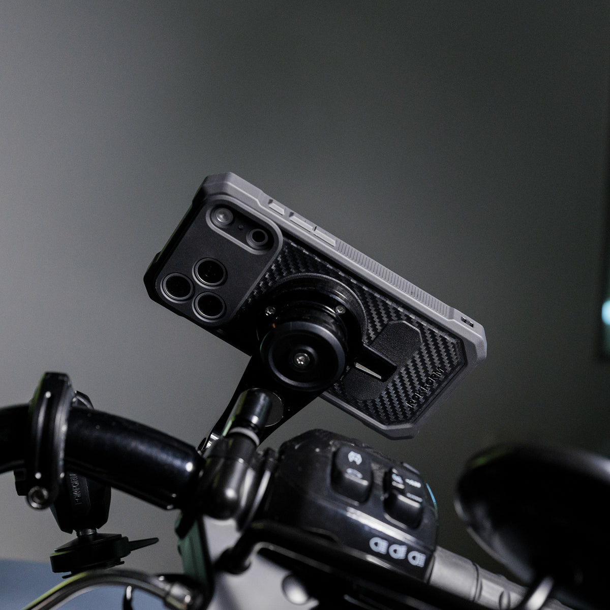 Close-up of a Rokform Rugged Case mounted on motorcycle handlebars