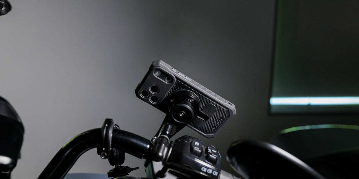 iPhone in a Rokform Rugged Case twist-locked to a motorcycle handlebar mount