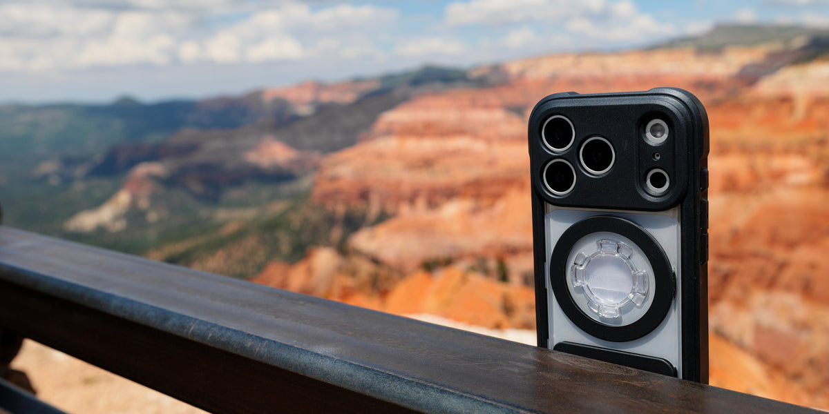 Rokform Crystal Case held in hand with rolling golden hills behind
