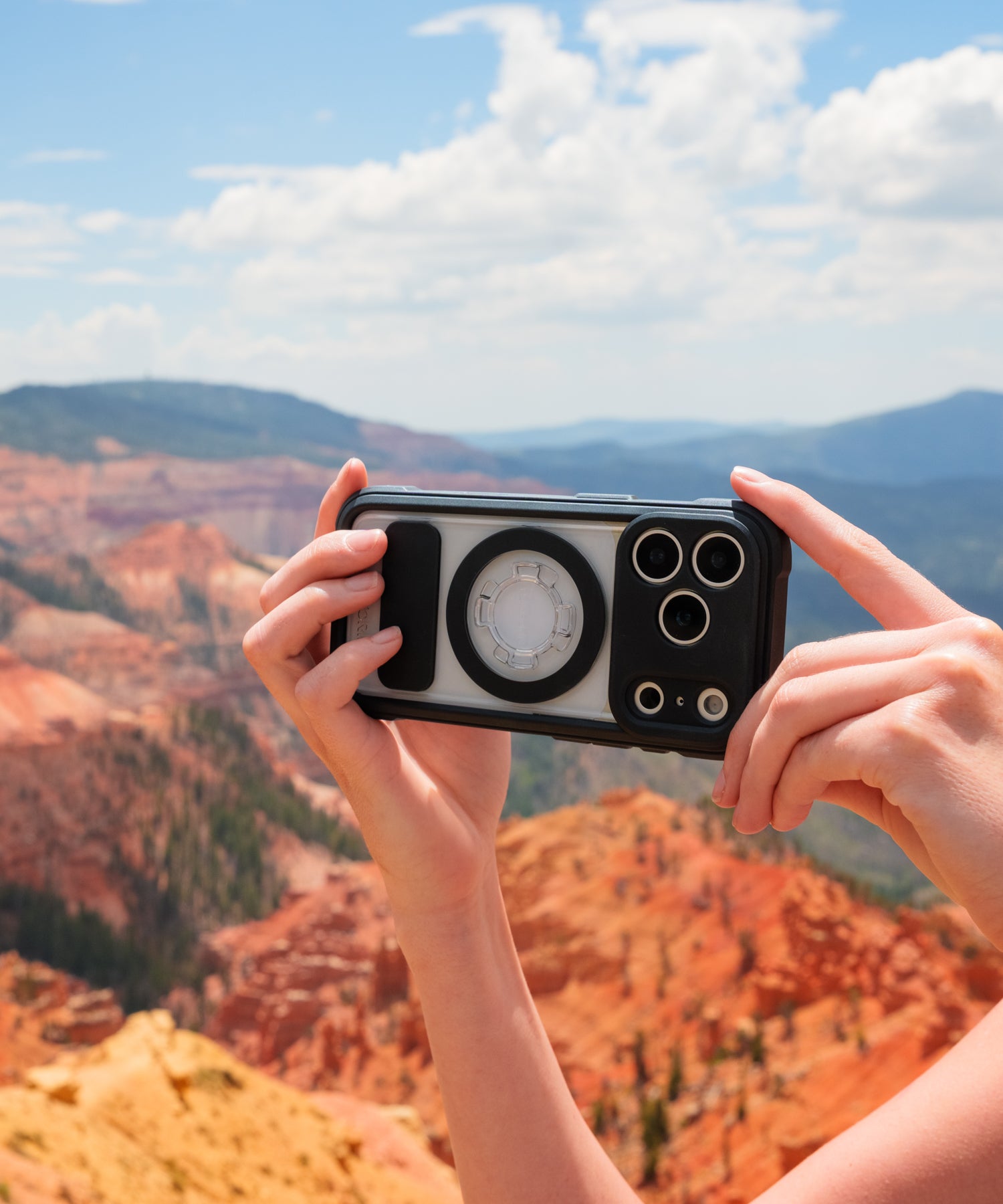 Person shooting landscape photos in Utah with an iPhone in a Rokform Crystal Case